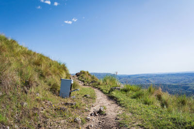 Scenic view of land against clear blue sky
