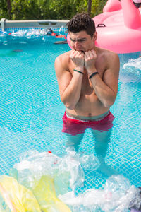 Man swimming in pool