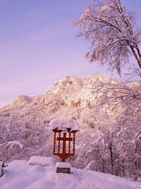 Scenic view of snow covered mountain against sky