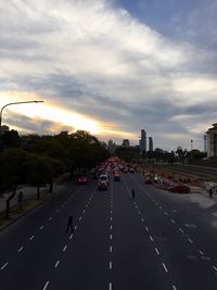 City street against cloudy sky