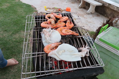 High angle view of preparing food on barbecue grill