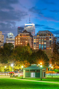 Buildings in city at night