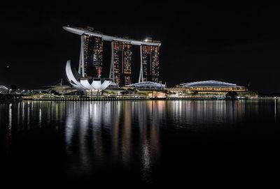 Illuminated city at waterfront