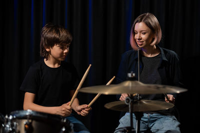 Young man playing drum