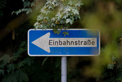 Close-up of information sign on road