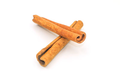 High angle view of broken coffee on table against white background