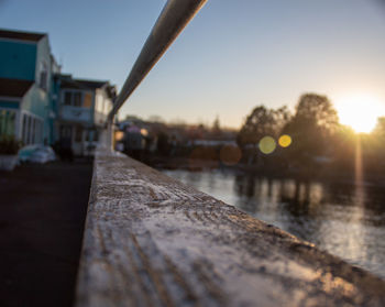 Surface level of road against sky during sunset