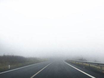 Road passing through fog