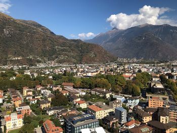 High angle view of townscape and mountains against sky