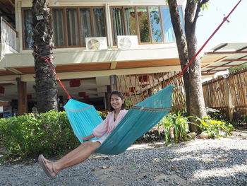 Portrait of a girl sitting on hammock