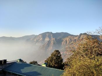 Scenic view of mountains against clear blue sky