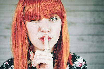 Close-up of woman with finger on lips