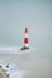 Lighthouse surrounded by the sea