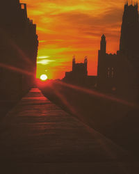 Silhouette of building at sunset