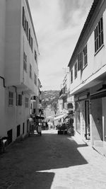 Street amidst buildings against sky