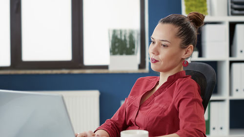 Young businesswoman working in office