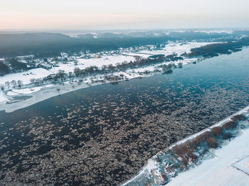 High angle view of frozen river in city