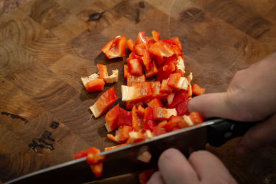 High angle view of person preparing food on cutting board