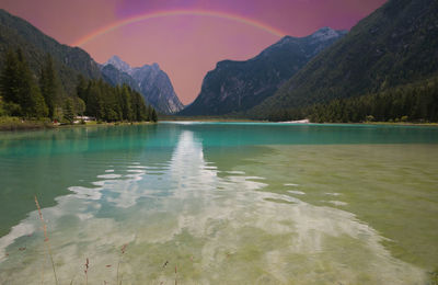 Scenic view of lake and mountains against sky