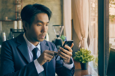 Young man using mobile phone