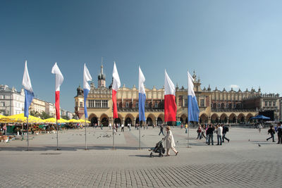 People at town square against clear sky