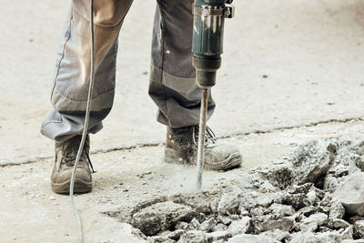 Low section of man working on water