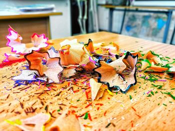 Close-up of multi colored pencils on table