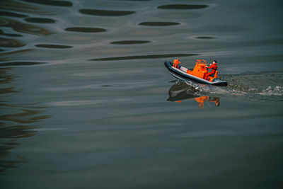 High angle view of toy boat floating on lake