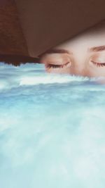 Portrait of woman relaxing in swimming pool