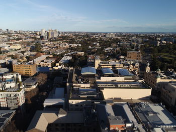 High angle view of buildings in city against sky