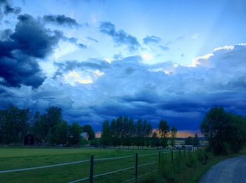 Scenic view of landscape against cloudy sky