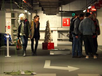 People standing in illuminated room