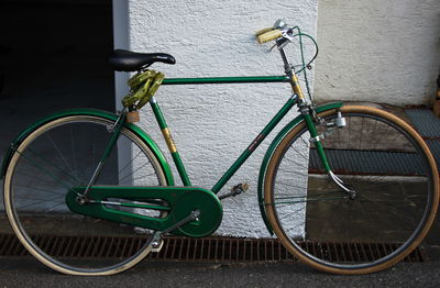 Close-up of bicycle against wall