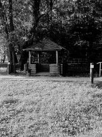 House and trees on field