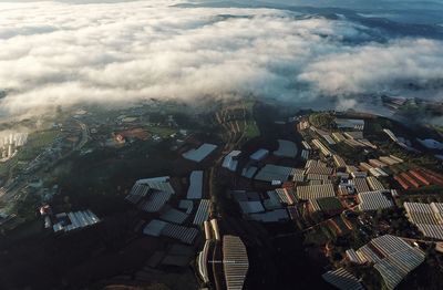 High angle view of trees and buildings against sky