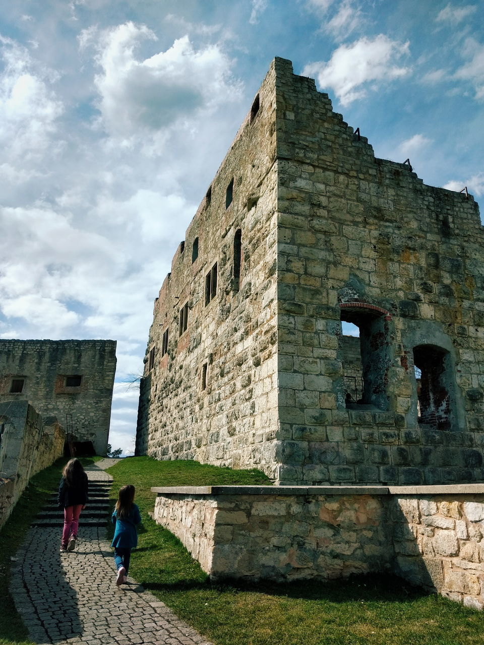 architecture, built structure, building exterior, the past, history, real people, women, day, cloud - sky, nature, sky, building, lifestyles, leisure activity, men, old, wall, people, walking, adult, outdoors, stone wall