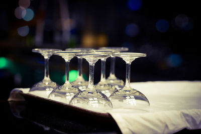 Close-up of wine glasses on table