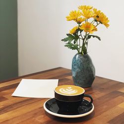 Flower vase on table
