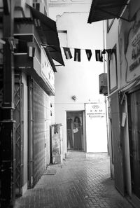 Surface level of narrow walkway along buildings