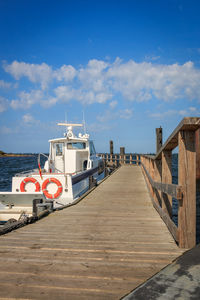 Pier amidst sea against sky