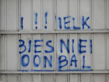 Scrambled graffiti on the back of a billboard