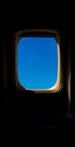 Directly below shot of sky seen through airplane window