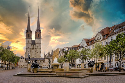 Panoramic view of buildings against sky during sunset