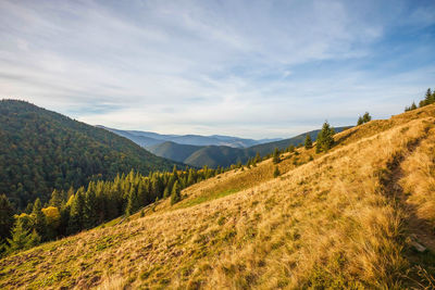 View of a field with mountain range in the background