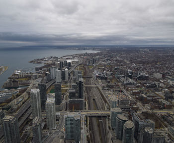 High angle view of city buildings against sky