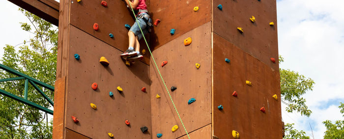 An artificial climbing wall created for children on the playground. training in basic skills