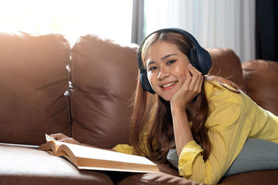 Young woman reading book