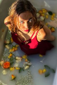 Portrait of a young woman with toy