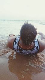 Rear view of man on beach