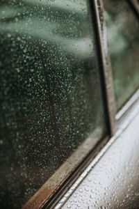 Close-up of wet window during rainy season